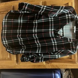 a black,white, and red plaid blouse.